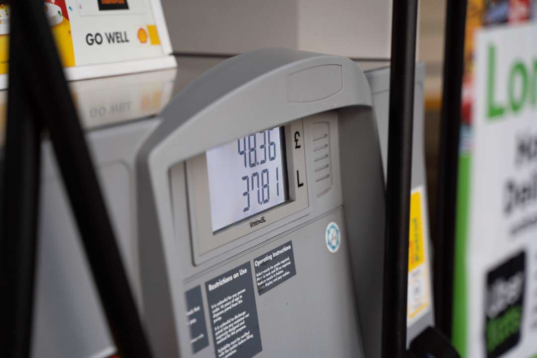 Petrol pump display showing total cost and litres.