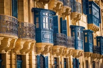 Traditional Maltese balconies on historic building facade.