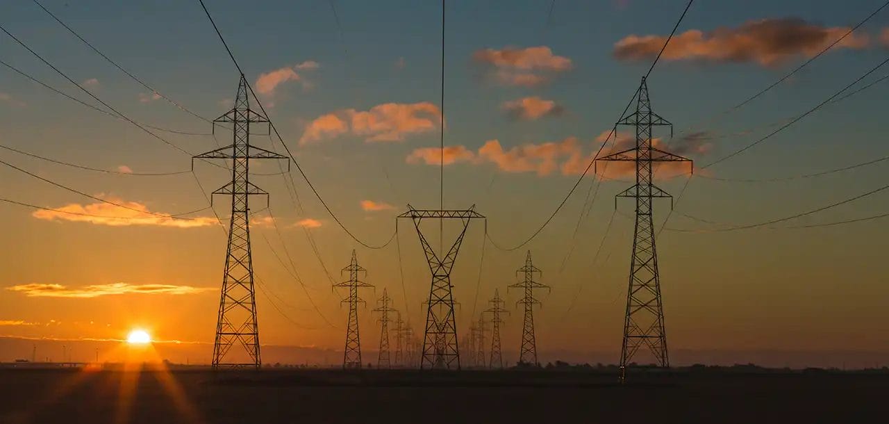 Power lines at sunset, scenic view