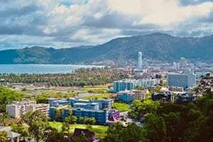 Phuket cityscape with mountains and ocean view.
