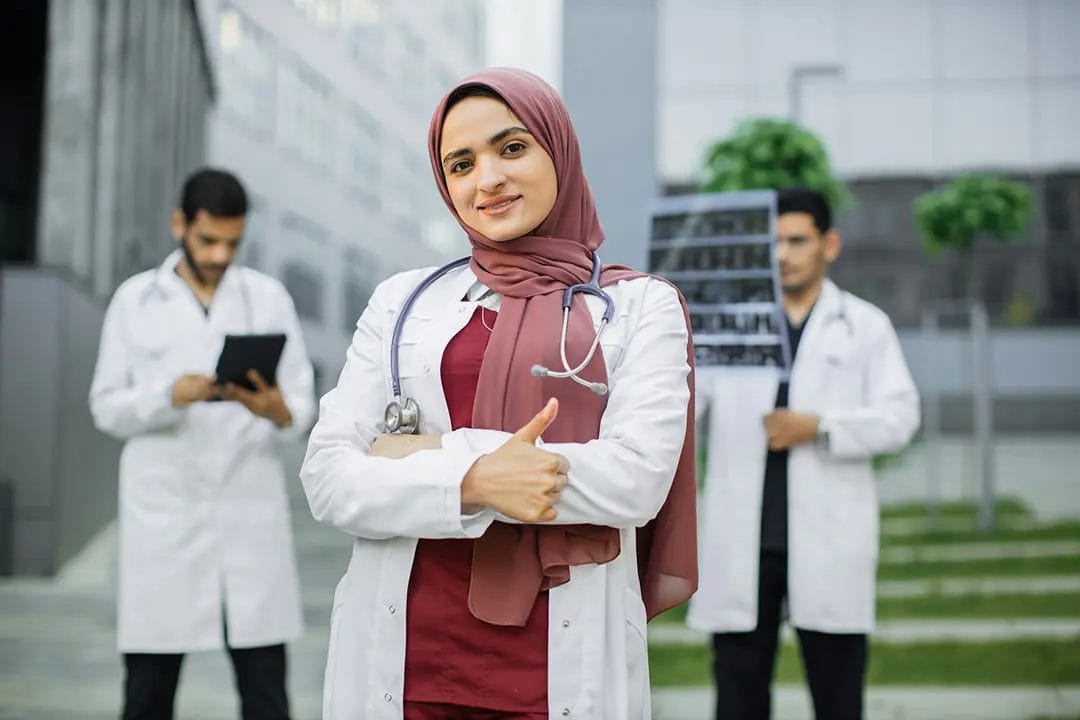 Confident female doctor with stethoscope, outdoor setting.