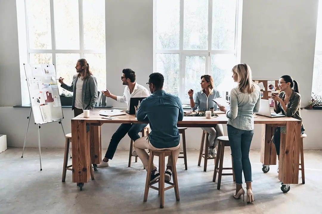 Team collaborating in a modern office meeting.