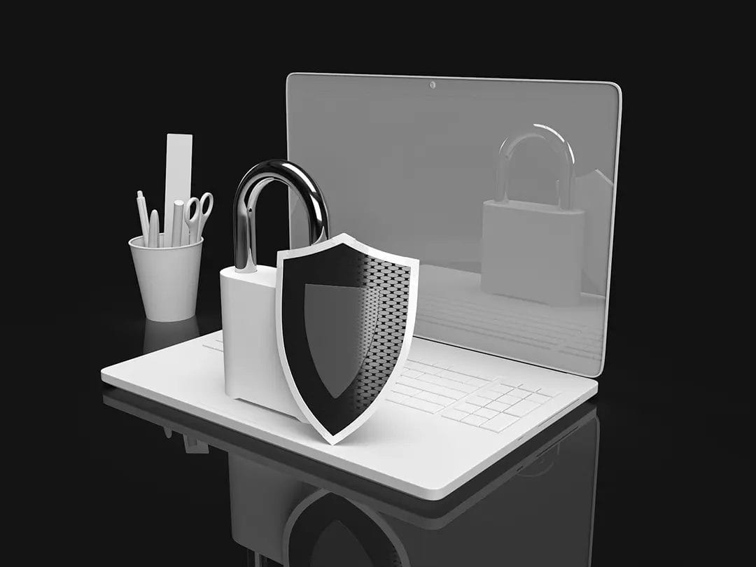 Cybersecurity concept with lock and shield on laptop.