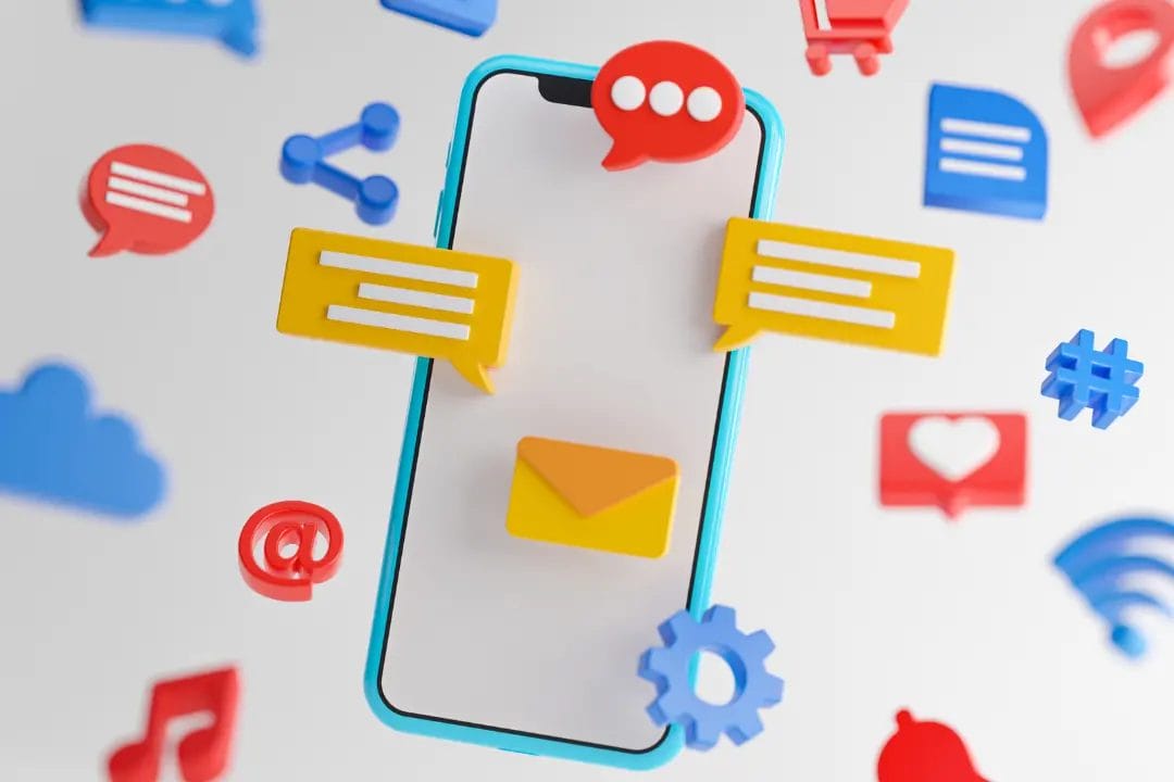 Smartphone surrounded by colourful social media icons.